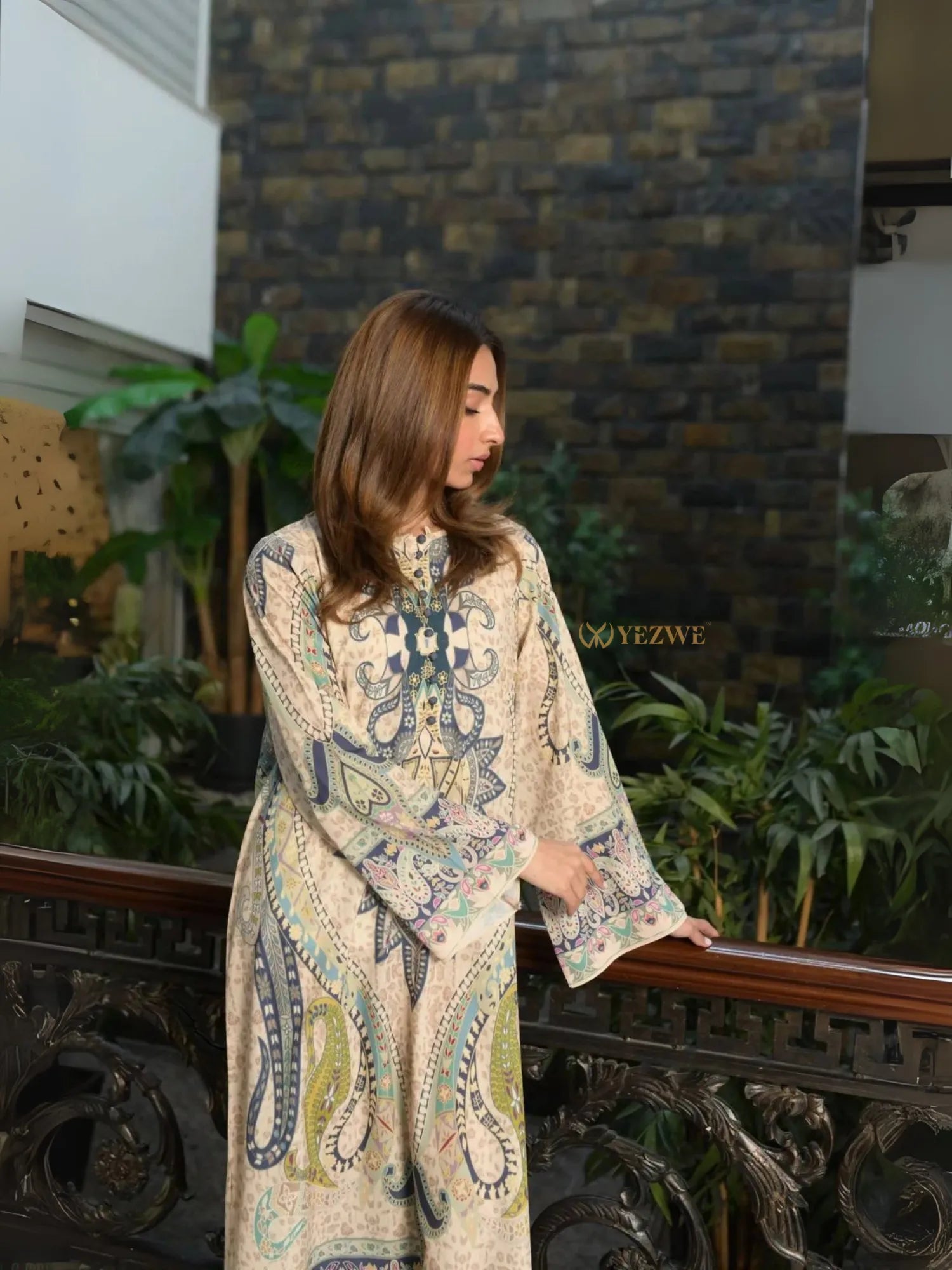 Yezwe Modest Kaftan Dress beige paisley tunic with long sleeves relaxed fit modeled by woman on indoor balcony