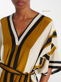 YEZWE Modest Kaftan in cream with bold stripes and a flattering V-neck design