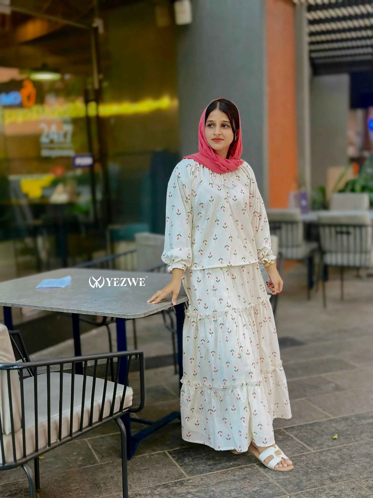 Modest Korean oneset outfit featuring a tiered skirt and long-sleeve top with a stylish headscarf