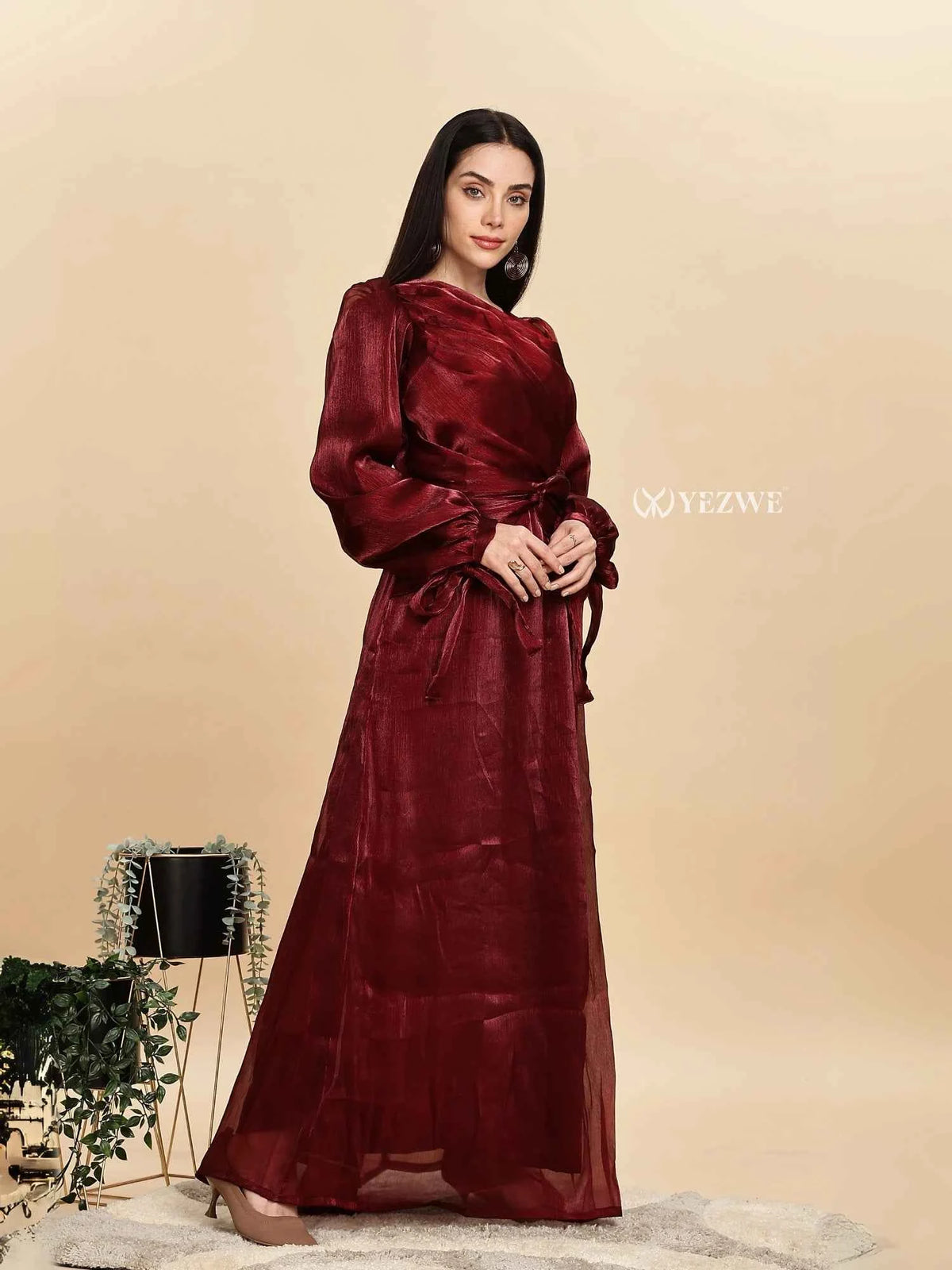 Modest maroon party gown by Yezwe featuring elegant flowy sleeves and a cinched waist