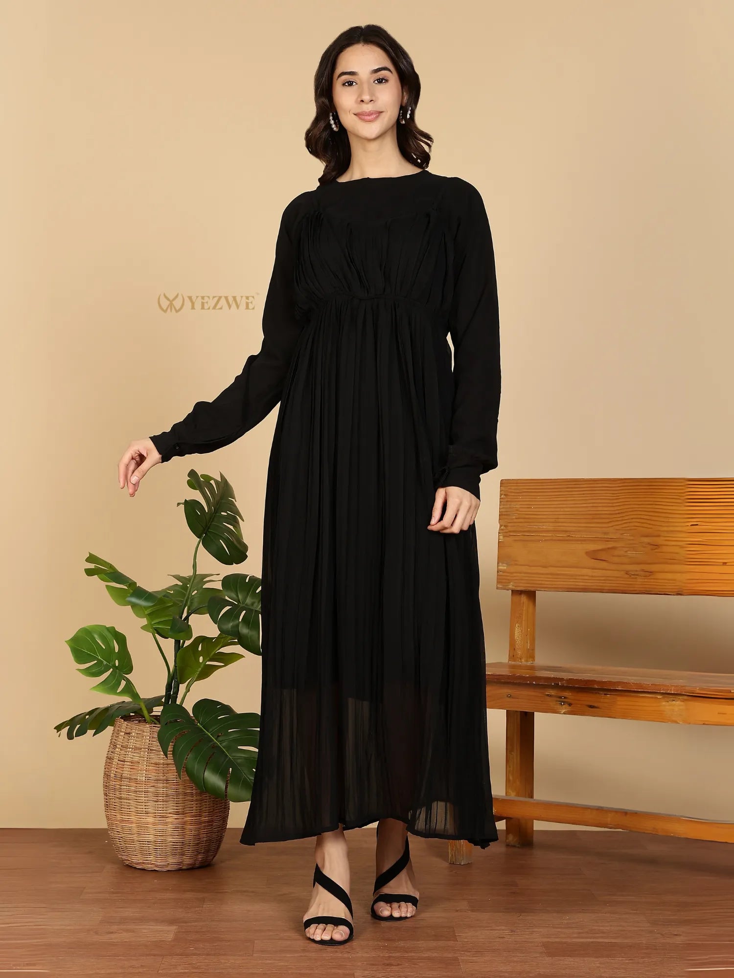 YEZWE Modest Maxi Dress black long sleeve pleated chiffon maxi dress on model with sandals