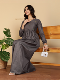 Yezwe Modest Maxi Dress gray long sleeve gathered waist model seated on wooden bench holding white handbag