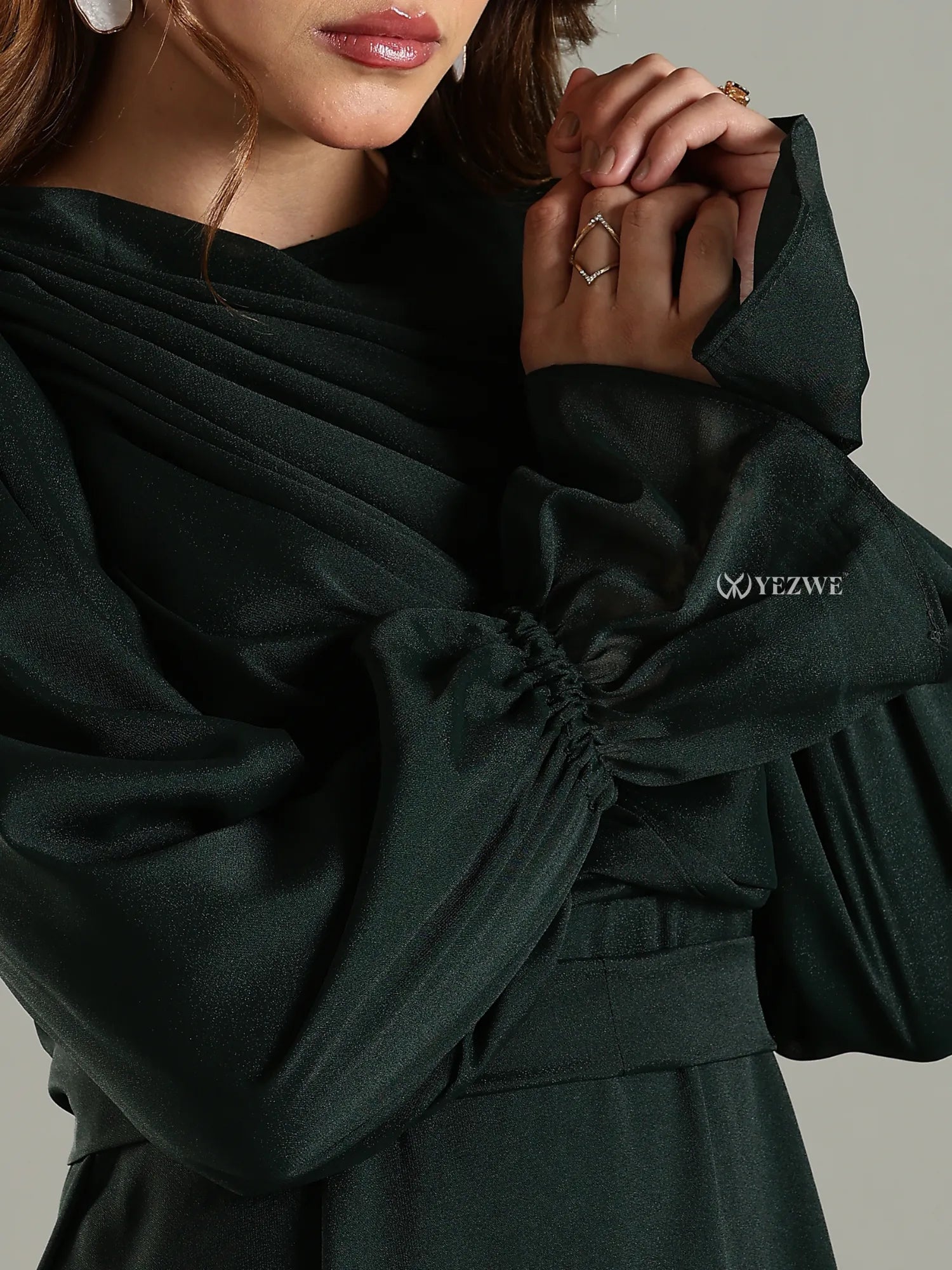 Yezwe modest maxi dress in dark fabric with gathered sleeves and elegant draping detail
