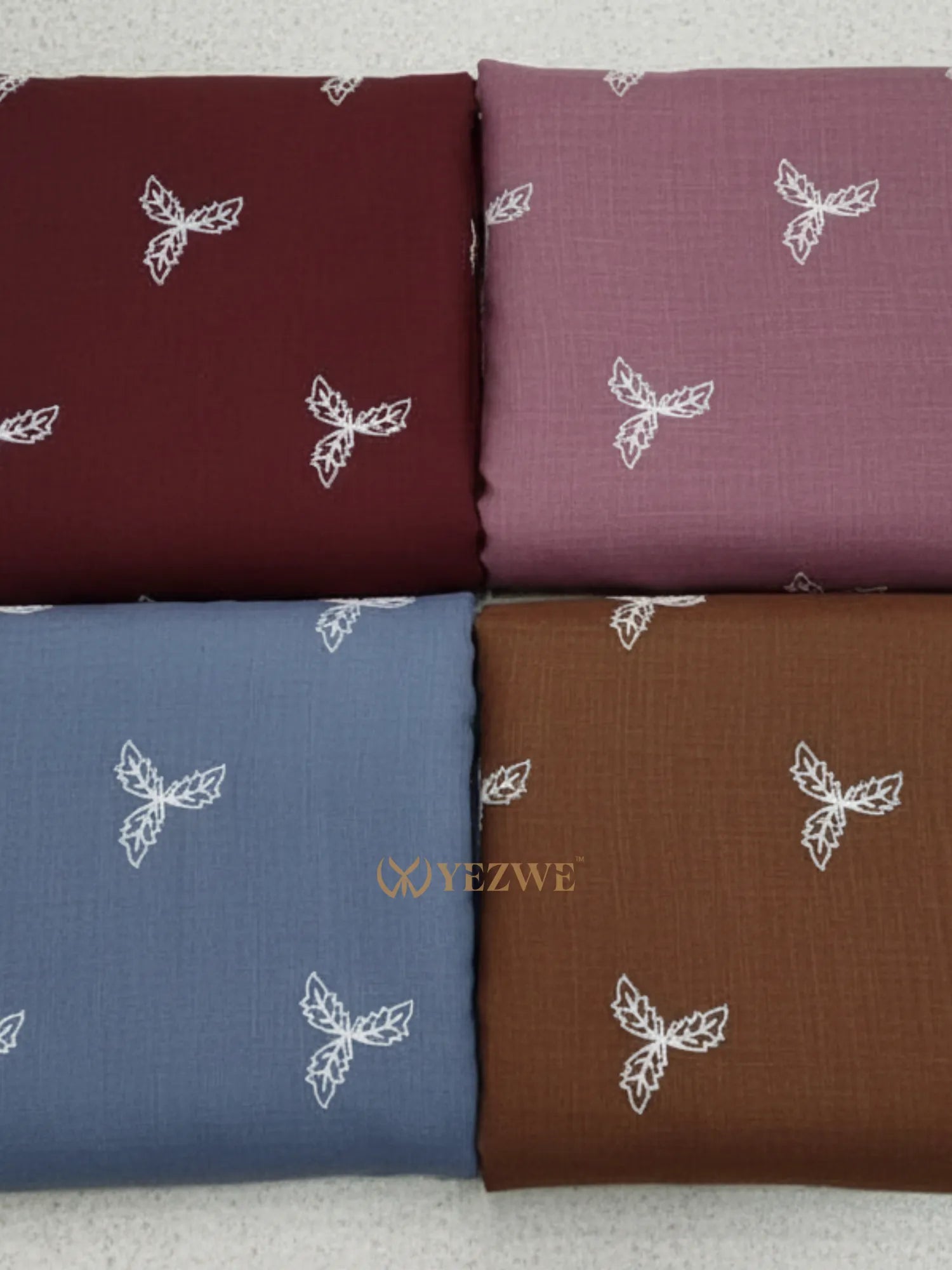 YEZWE Modest Maxi Dress fabric swatches in burgundy, pink, blue, and brown with floral embroidery