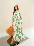 Yezwe modest maxi dress tunic with green leaf print on white background, long sleeves and flowing design