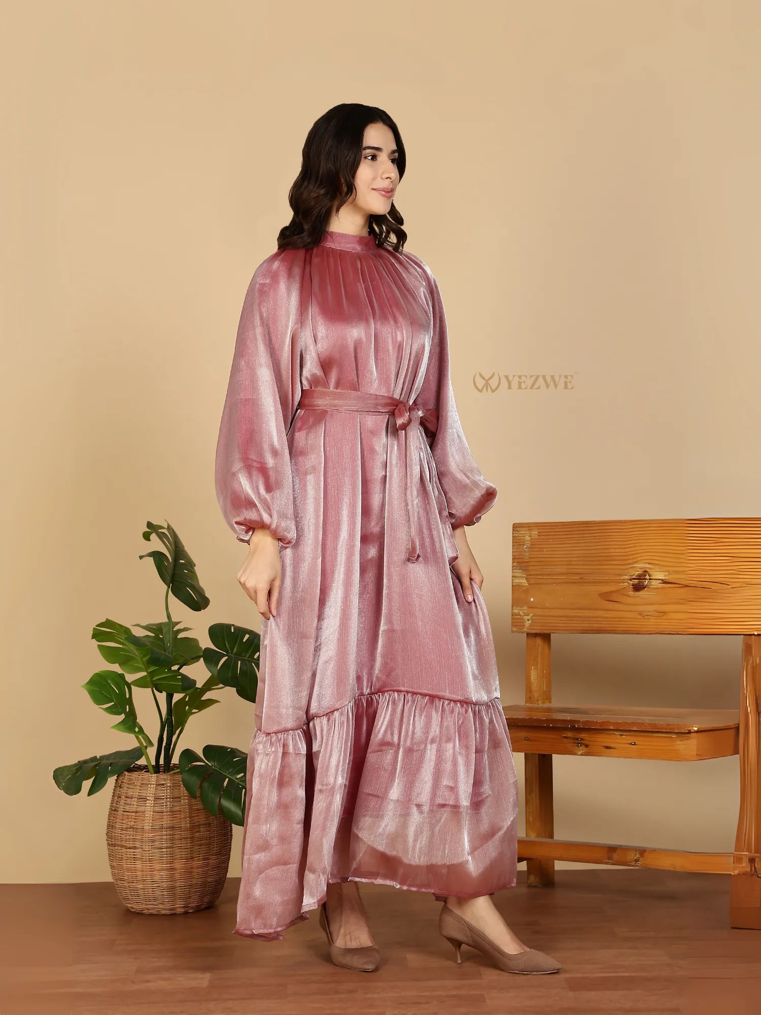 YEZWE Modest Maxi Dress pink satin long sleeve with high neck belt tiered hem worn by model