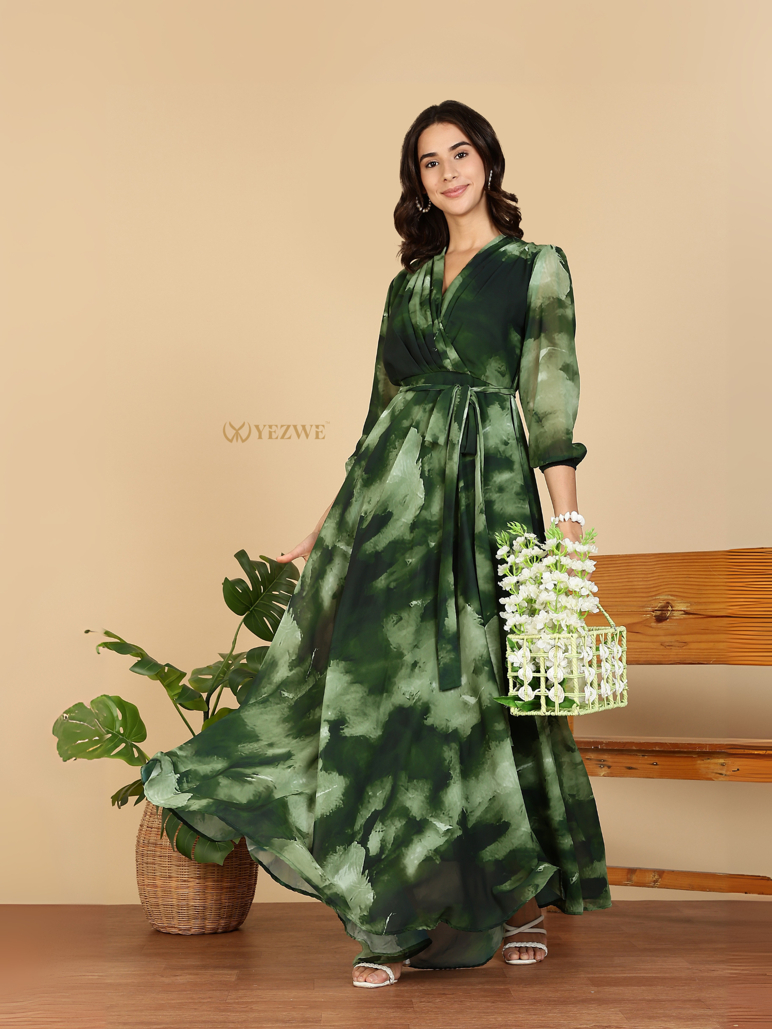 Yezwe Modest Maxi Dress green watercolor wrap with sash belt three quarter sleeves flowing skirt model holding floral basket