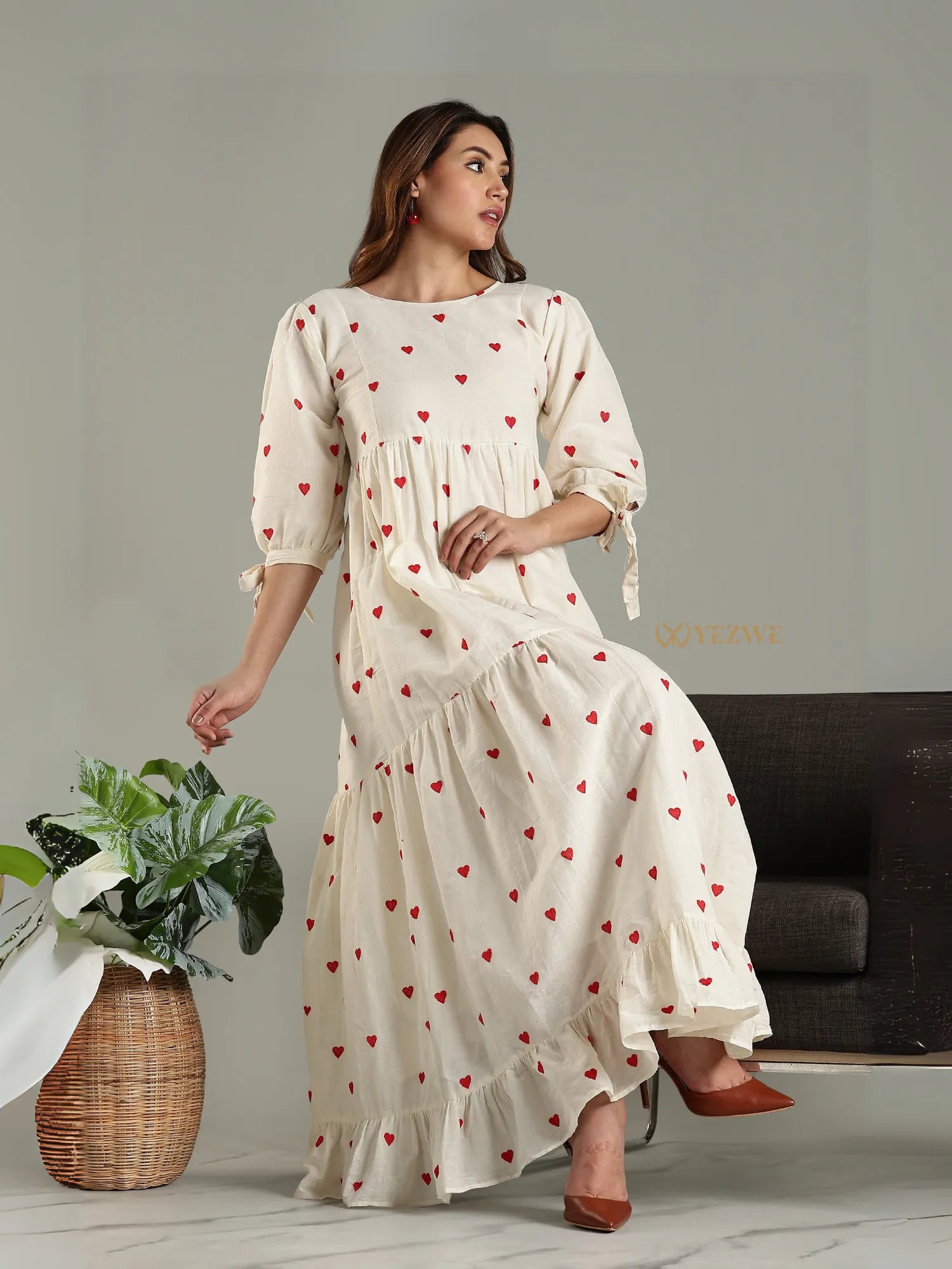 Yezwe modest maxi dress in cream with red heart prints and three-quarter sleeves styled with brown heels