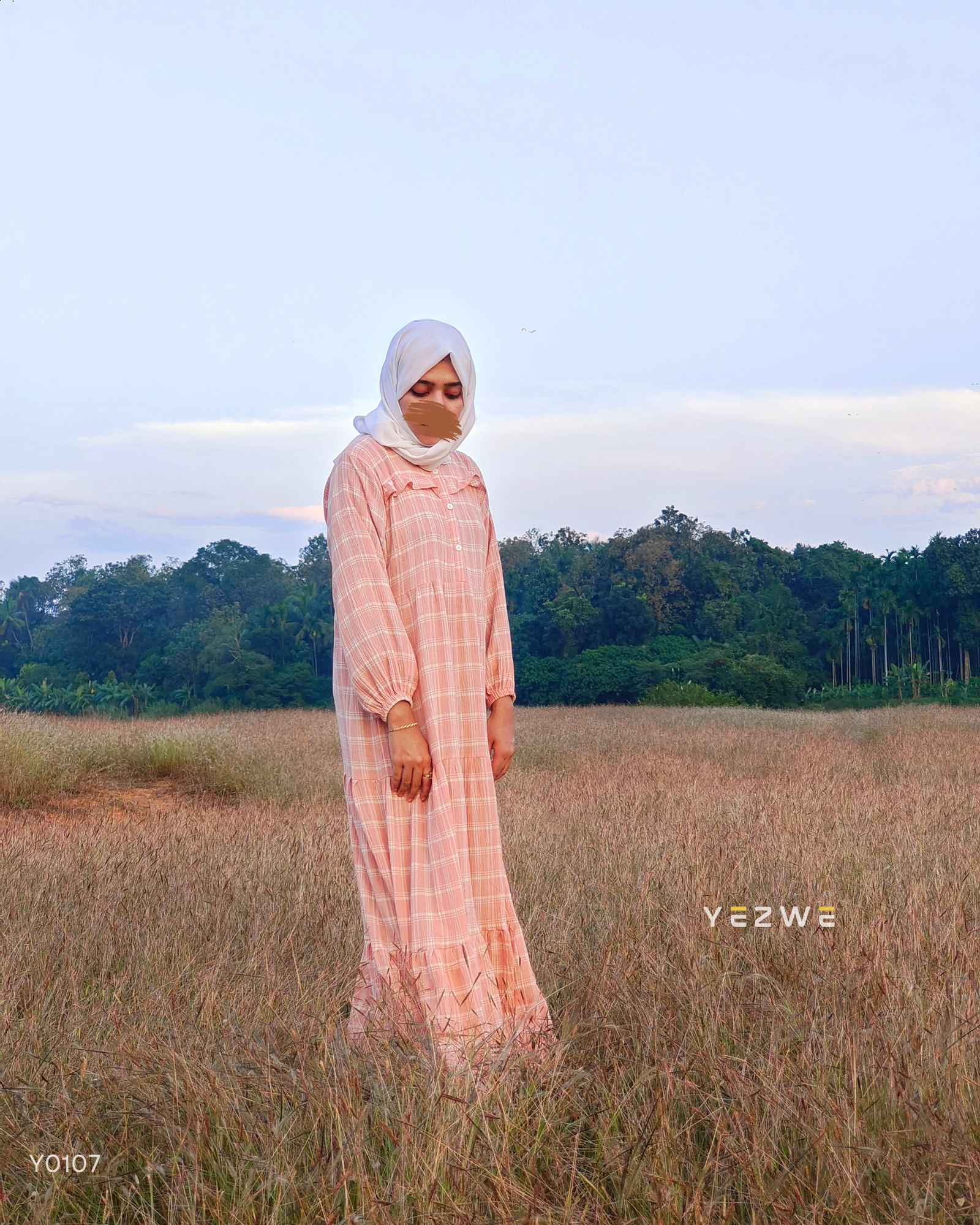 Modest oversized maxi dress by Yezwe in soft peach with long sleeves and tiered design