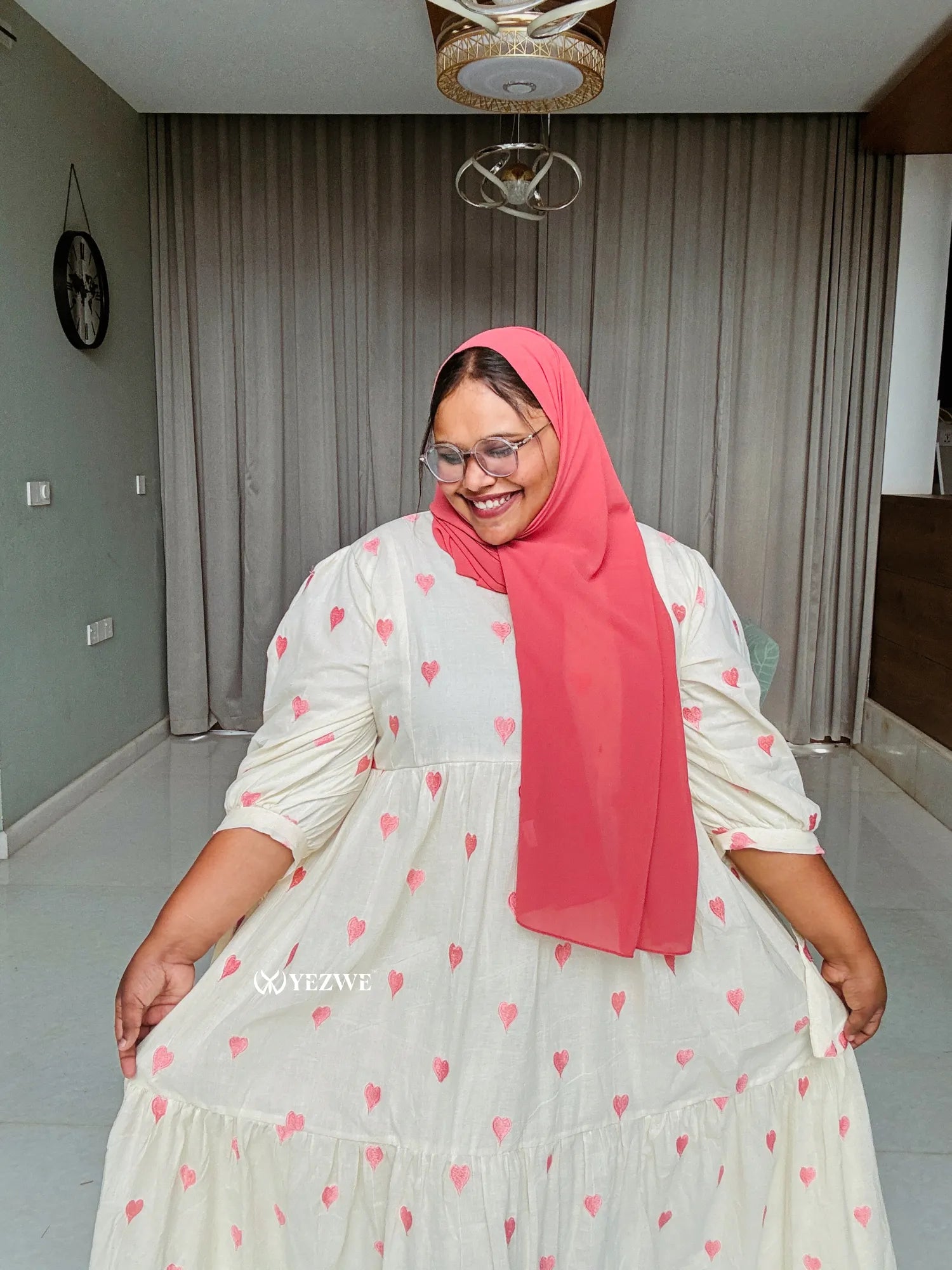 Modest pastel pink maxi dress with heart print and long sleeves for comfortable summer wear