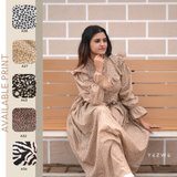 Yezwe modest print maxi dress in beige with ruffled sleeves, styled elegantly on a model sitting on a bench