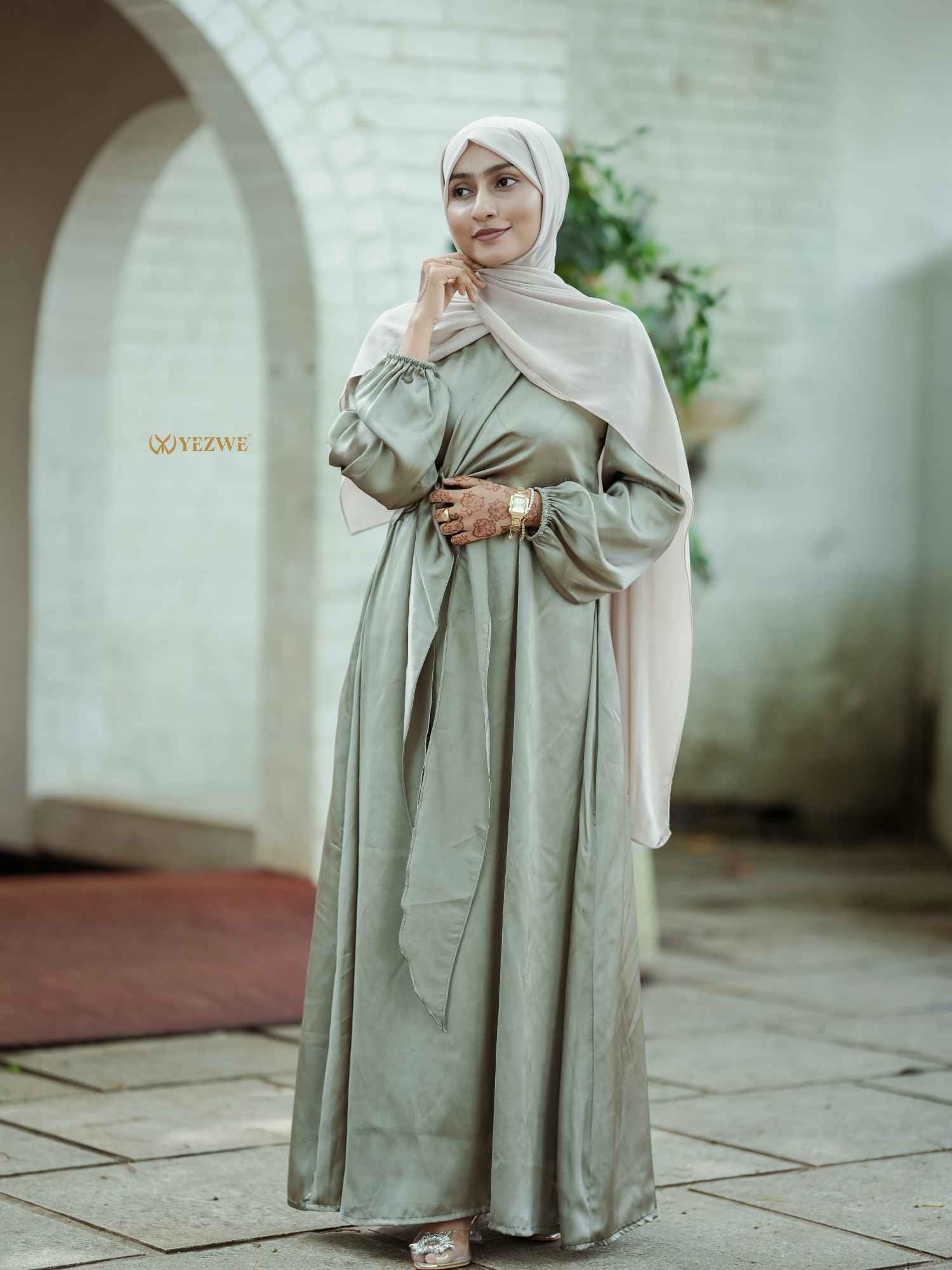 Yezwe modest satin maxi dress in olive green with elegant long sleeves and a flowing silhouette