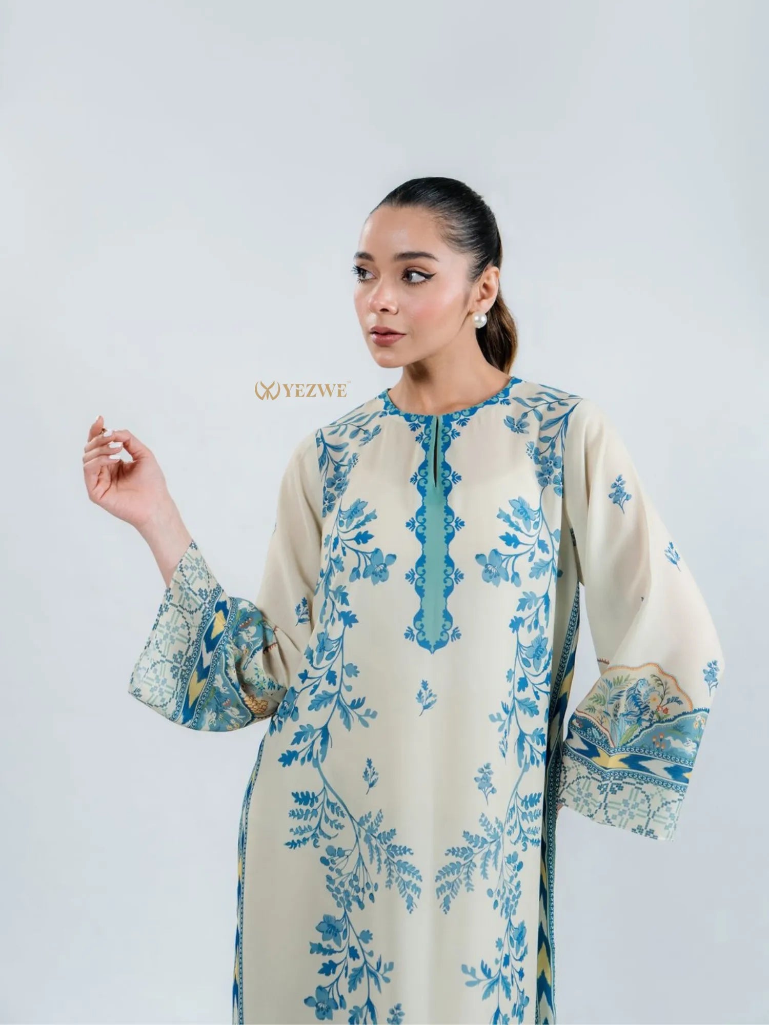 YEZWE modest top with bottom co-ord set in cream with blue floral designs and long bell sleeves
