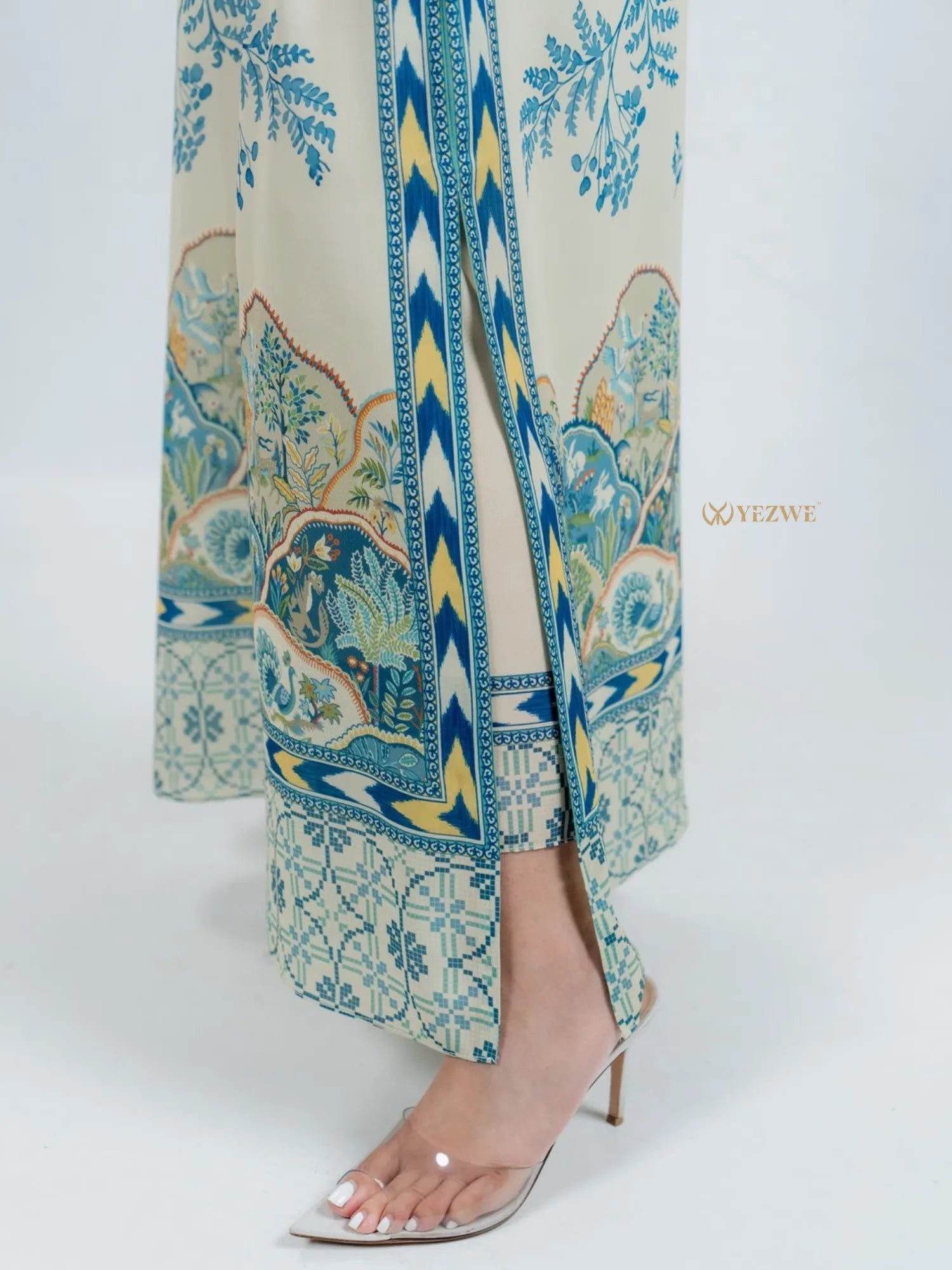 YEZWE co-ord set featuring modest top with bottom in blue and beige floral print with side slit and clear heels