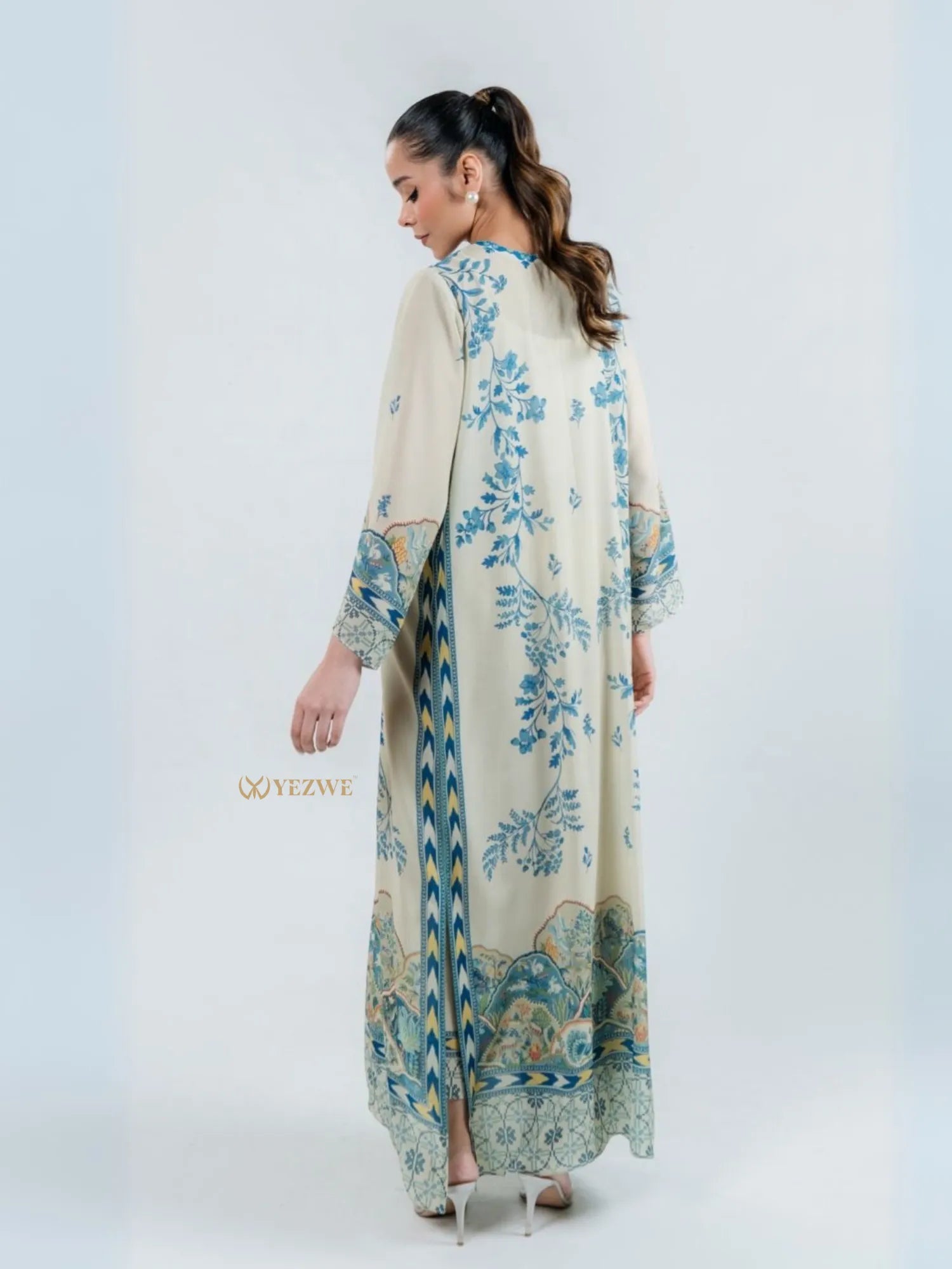 YEZWE modest top with bottom co-ord set featuring long cream dress with blue floral and patterned designs