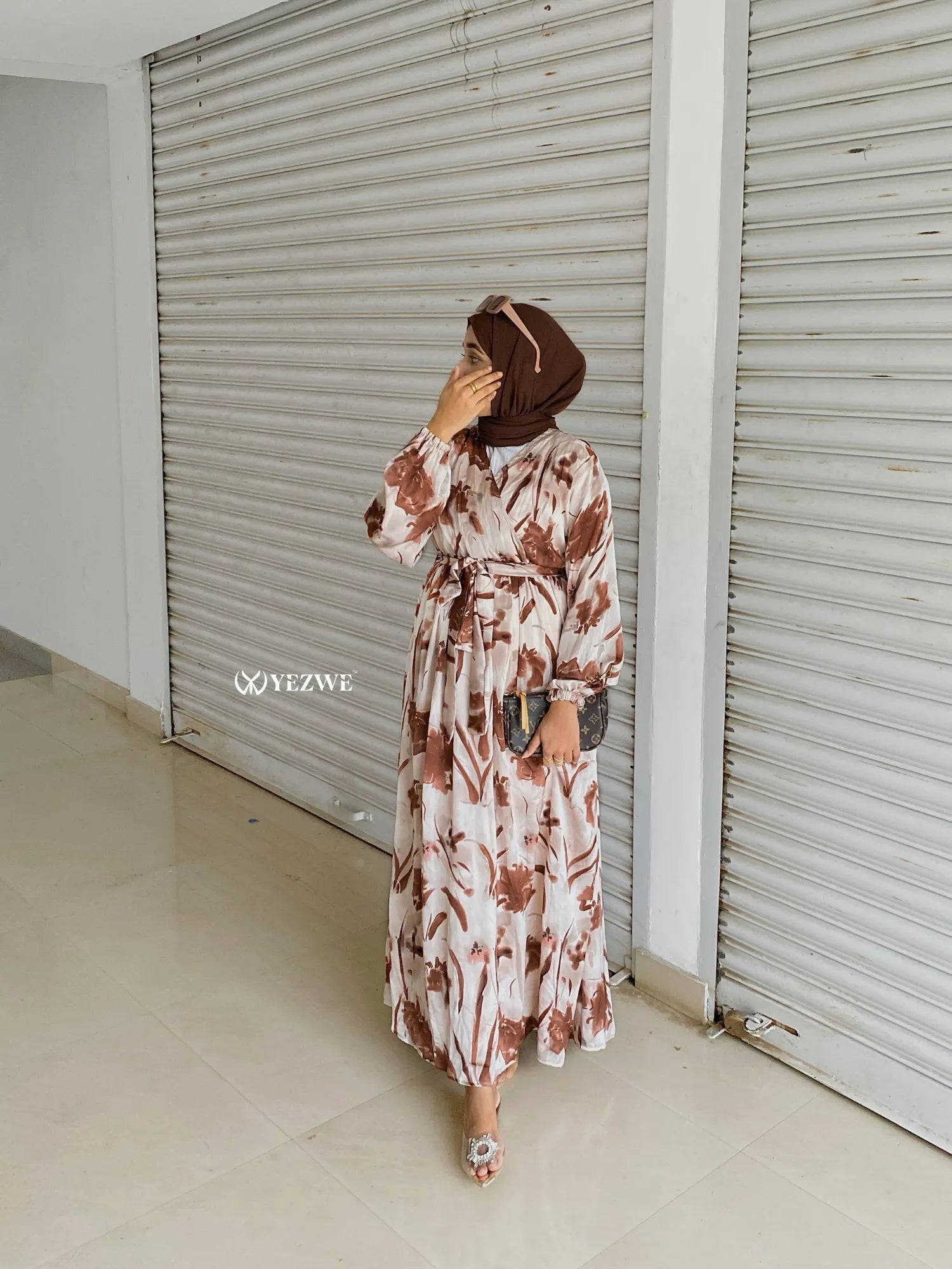 Yezwe modest V-neck dress in floral print featuring a cinched waist and long sleeves