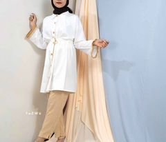 Yezwe modest wear co-ord set featuring a white button-up top and beige pants with a stylish belt