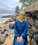 Yezwe modest wear dresses featuring a flowing blue maxi dress, perfect for beach outings