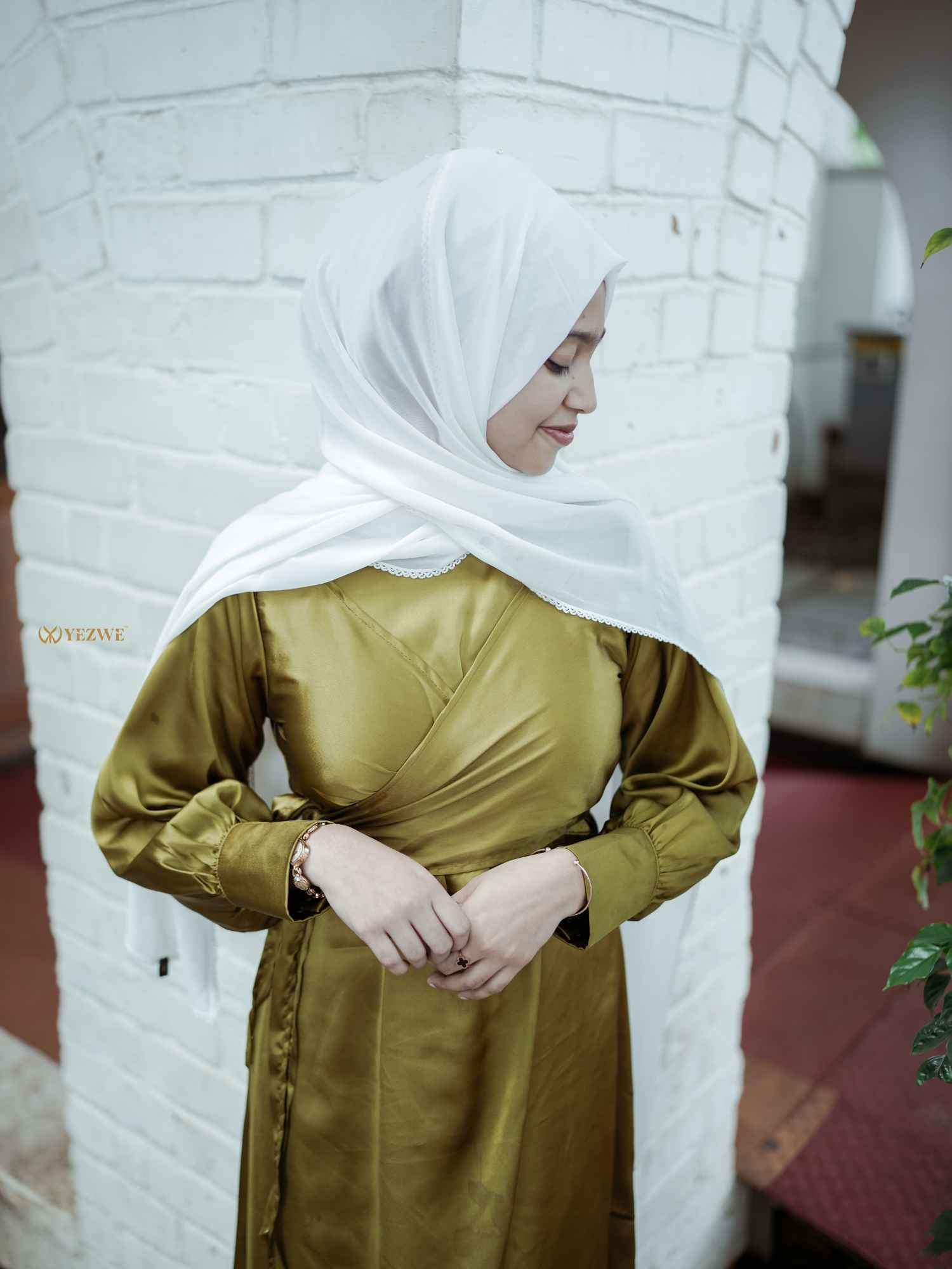 Yezwe modest wear flowing maxi dress in olive green, featuring a wrap design and long sleeves