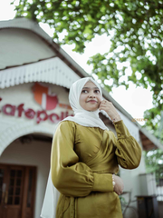 Yezwe modest wear flowing maxi dress in olive green, featuring a stylish design and elegant long sleeves