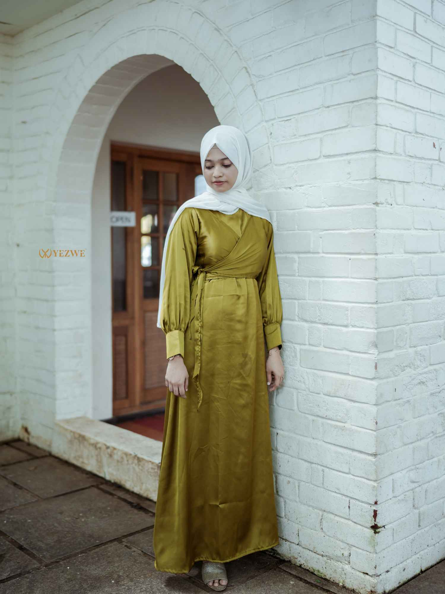 Yezwe modest wear flowing maxi dress in olive green with long sleeves and a wrap design