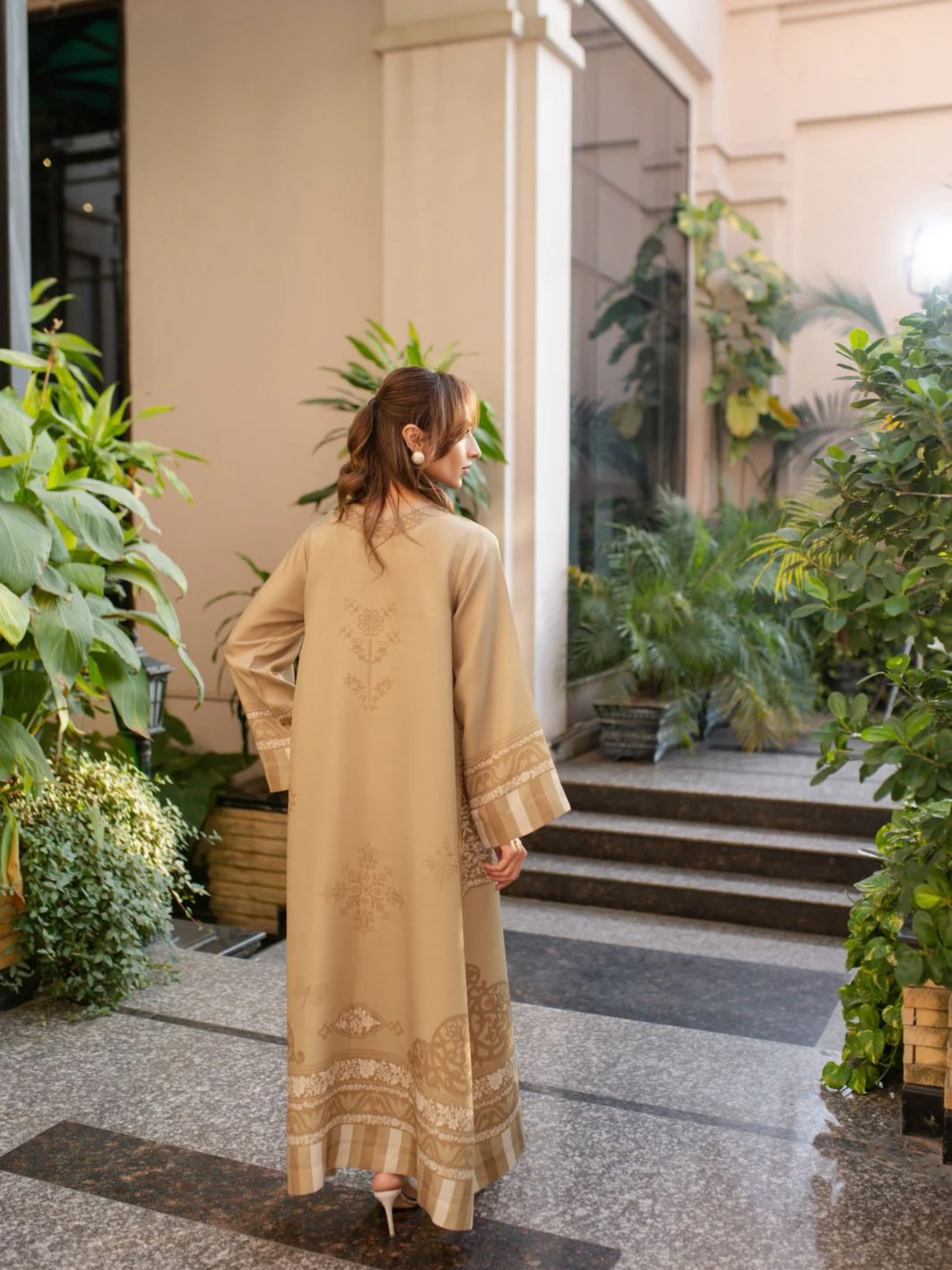 YEZWE Modest Wear Jalabiya Golden and Dull Full Length Comfortable Jalabiya Dress in a stylish garden setting