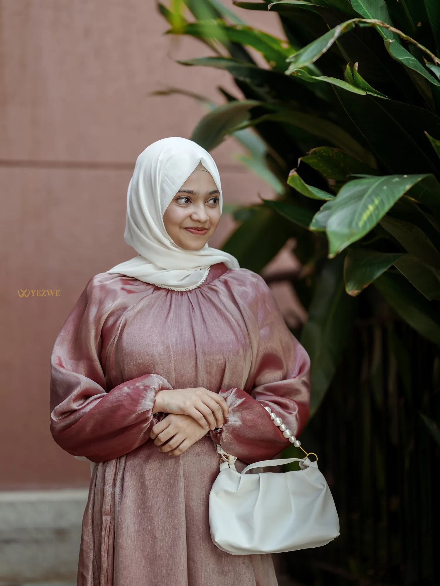 Yezwe modest wear maxi dress in soft pink with long sleeves and elegant details for stylish outings