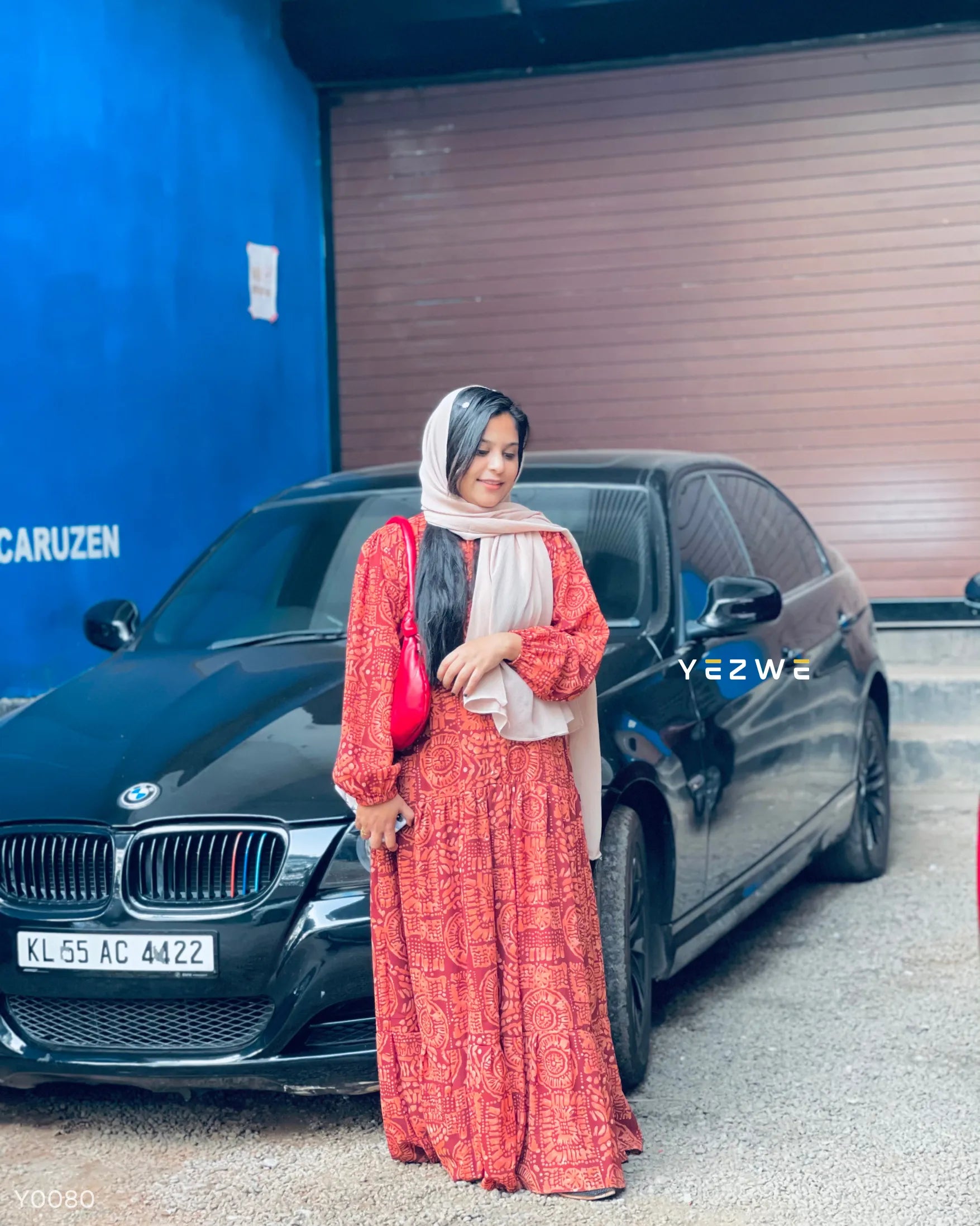 Yezwe Modest Wear Maxi Dress in vibrant orange pattern, perfect for casual outings and comfortable wear.