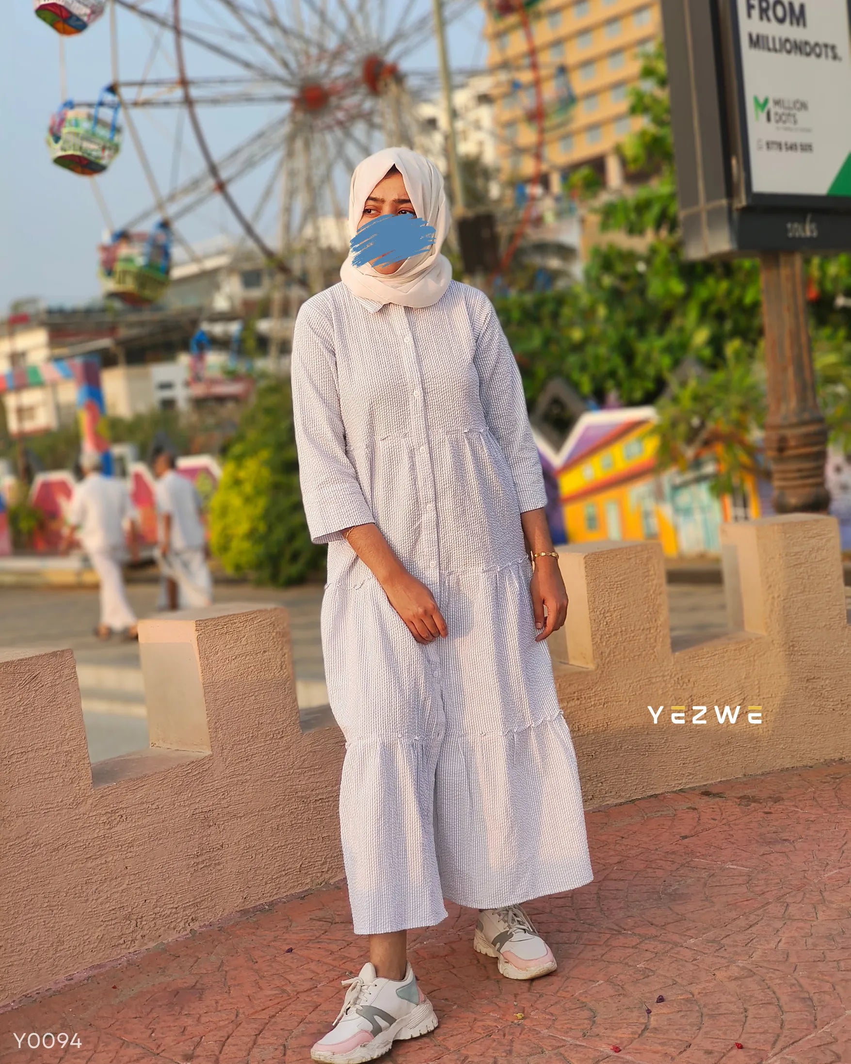 Yezwe modest wear maxi dress in light color with tiered design, perfect for casual outings