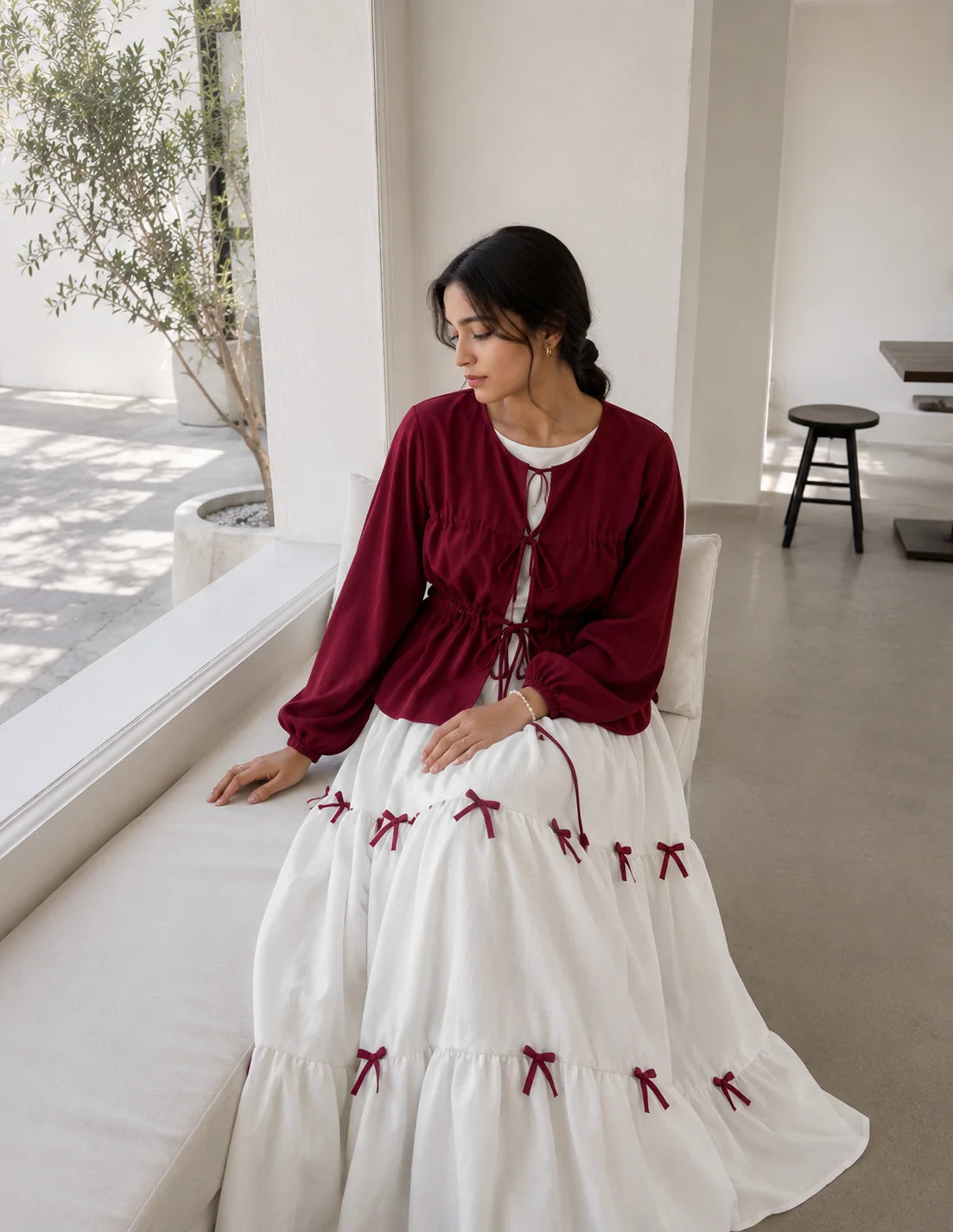 Pinterest Bow Detail White Flared Gown with Wine Crew Shrug | Yezwe Modest Wear worn by model in a bright setting