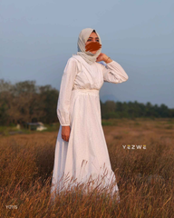 Yezwe modest white maxi dress with long sleeves, perfect for elegant casual wear in nature