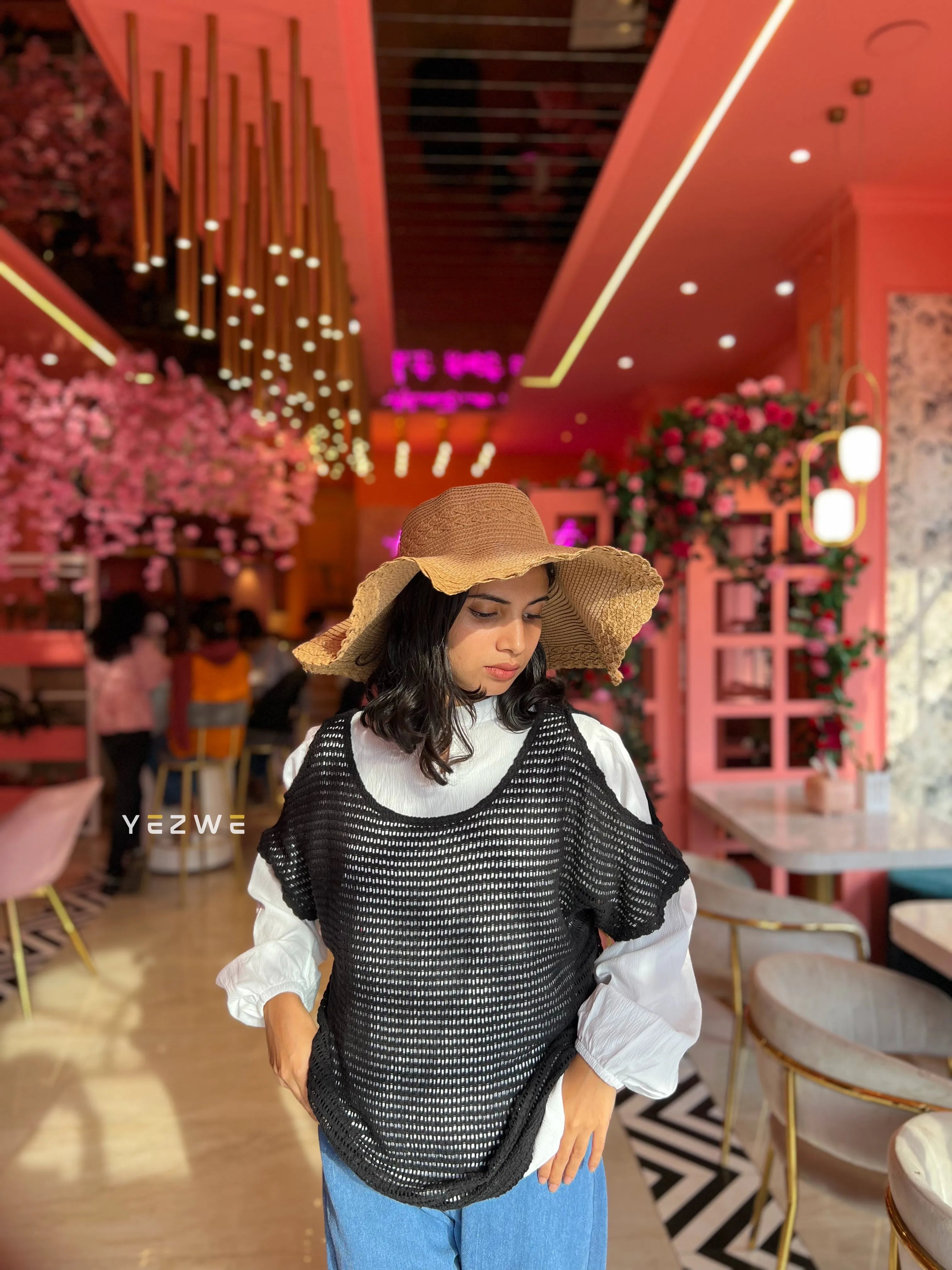 Yezwe modest women's shrug in black with a stylish mesh design, perfect for layering over outfits