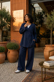 YEZWE Navy Blue Wrap Top and Wide Leg Pants Modest Co-ord Set styled outdoors in a chic setting