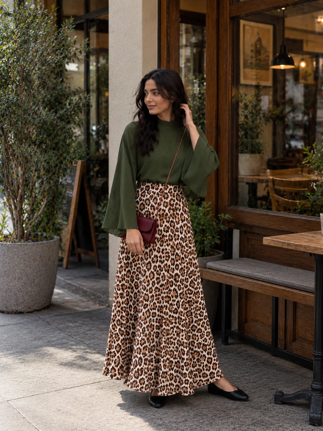 YEZWE Olive Green Bell Sleeve Blouse & Leopard Print High Waist Maxi Skirt Two-Piece Set on a woman outdoors