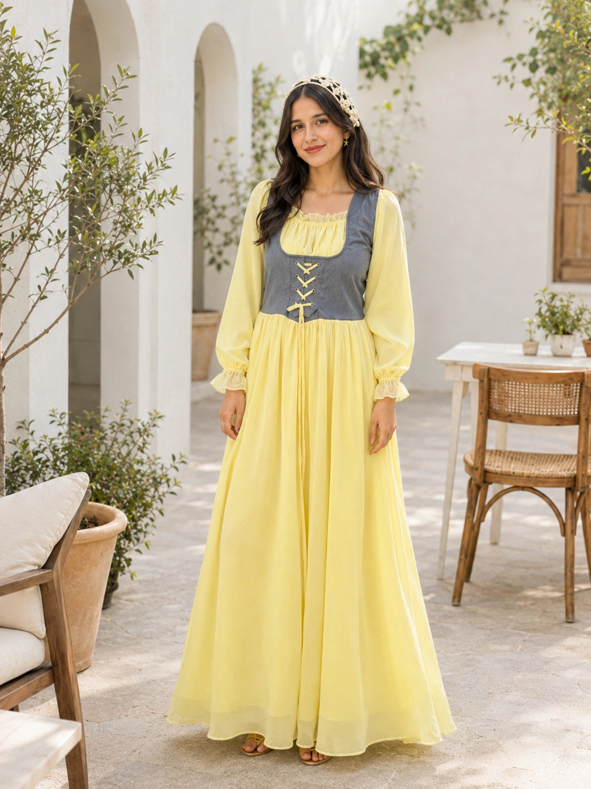 Yezwe Pastel Yellow Georgette Modest Corset Maxi Dress With Denim Bodice in an outdoor setting