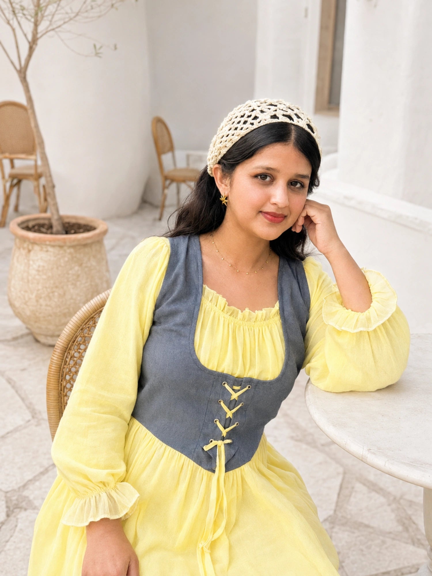Yezwe Pastel Yellow Georgette Modest Corset Maxi Dress With Denim Bodice worn by a model in a sunny outdoor setting