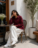 Elegant woman in burgundy Pinterest Tie-Detail Cey Shirt & Wide-Leg Pants Co-Ord Set - Yezwe Korean Wear at a café