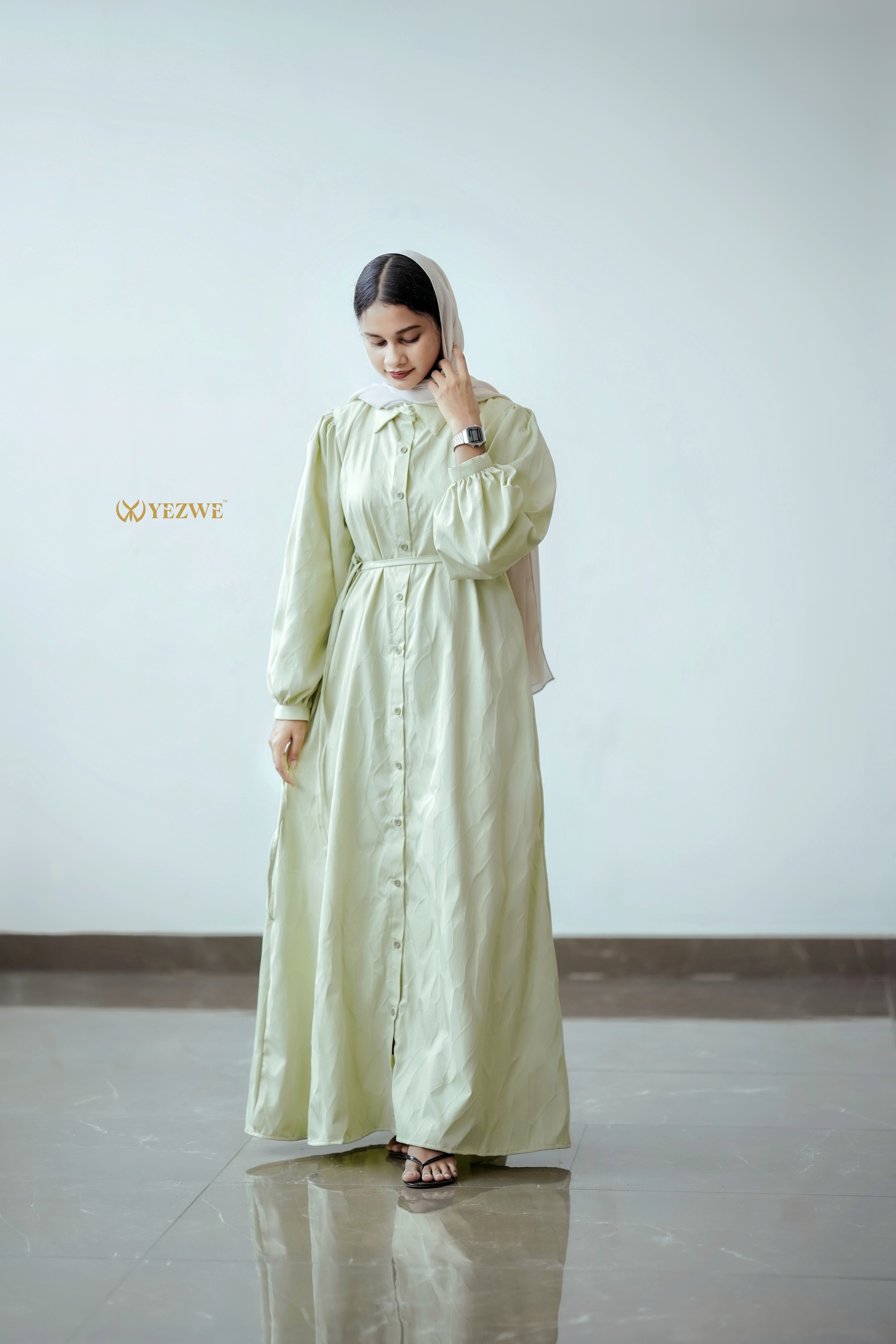 Elegant pista green jacquard dress by Yezwe featuring a button-down design and puff sleeves