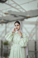 Elegant Yezwe pista green jacquard dress with puff sleeves and a cinched waist for stylish comfort