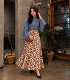 YEZWE Slate Blue Mock Neck Bell Sleeve Top & Leopard Print Flared Maxi Skirt in a stylish indoor setting