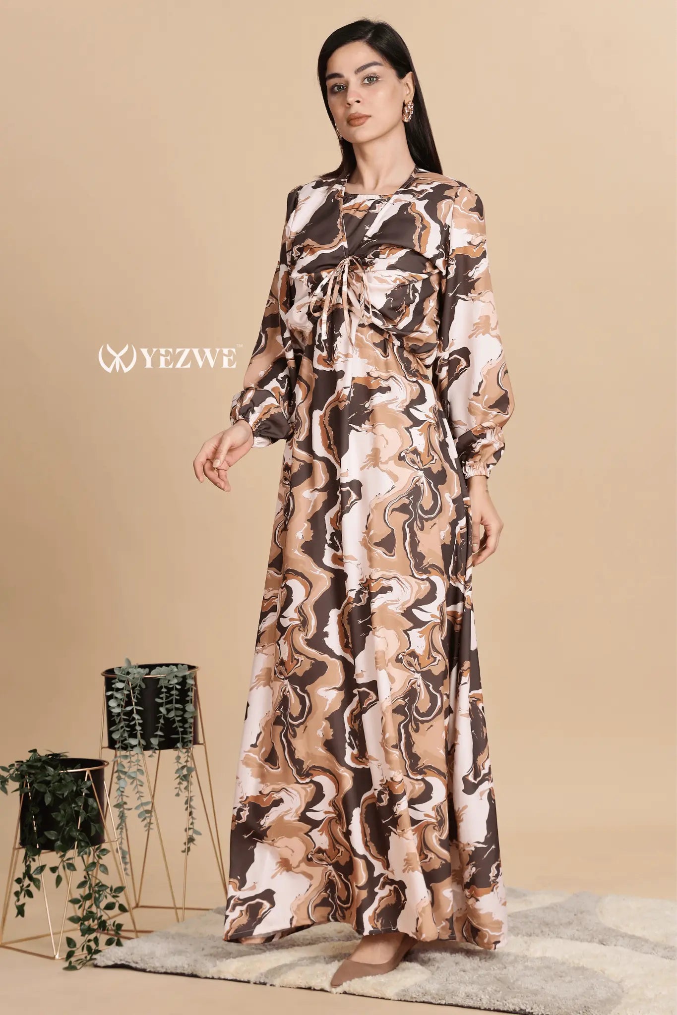 Elegant Swiss imported maxi dress in a brown and cream marbled design with long sleeves