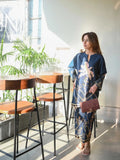 YEZWE top and pant co-ord set with floral prints in navy blue worn by a woman indoors