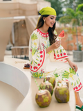 YEZWE white tunic with matching bottoms featuring tropical botanical print and model eating watermelon Turkish Co-Ord Set
