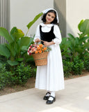 Junior girls in Yezwe Vintage Black Bodice Classic White Flared Maxi Dress holding a flower basket