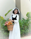 Junior girls wearing Yezwe Vintage Black Bodice Classic White Flared Maxi Dress holding a basket of flowers