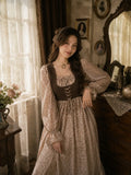 Woman wearing YEZWE vintage floral maxi dress with brown corset-style bodice, puff sleeves, and soft feminine modest styling in an elegant vintage-inspired indoor setting.