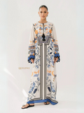 YEZWE cream maxi dress with blue and orange floral geometric print long sleeves and tassel tie on model Women Top