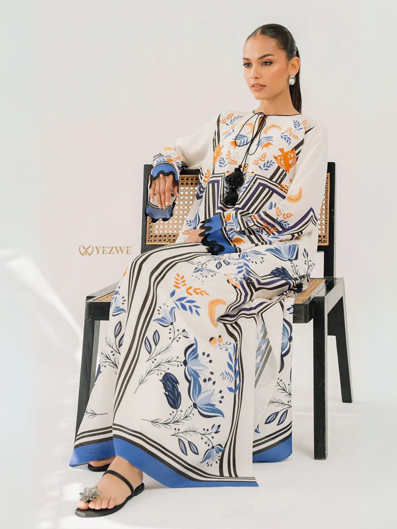 YEZWE floral print long sleeve maxi dress with tie neckline and relaxed fit model seated Women Top