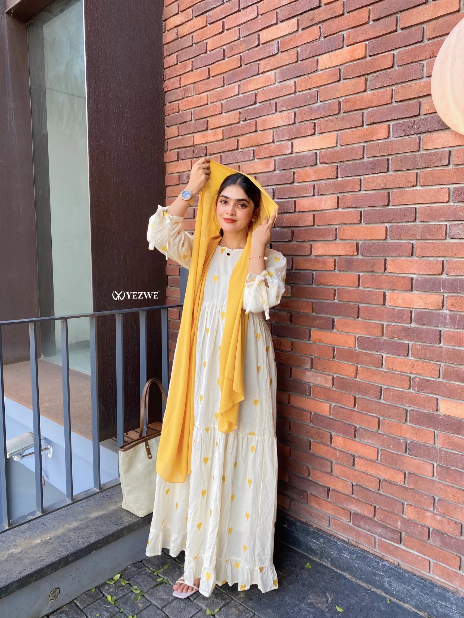 Yezwe Yellow Embroidered Maxi Dress with a flowing design and matching scarf for a chic summer look