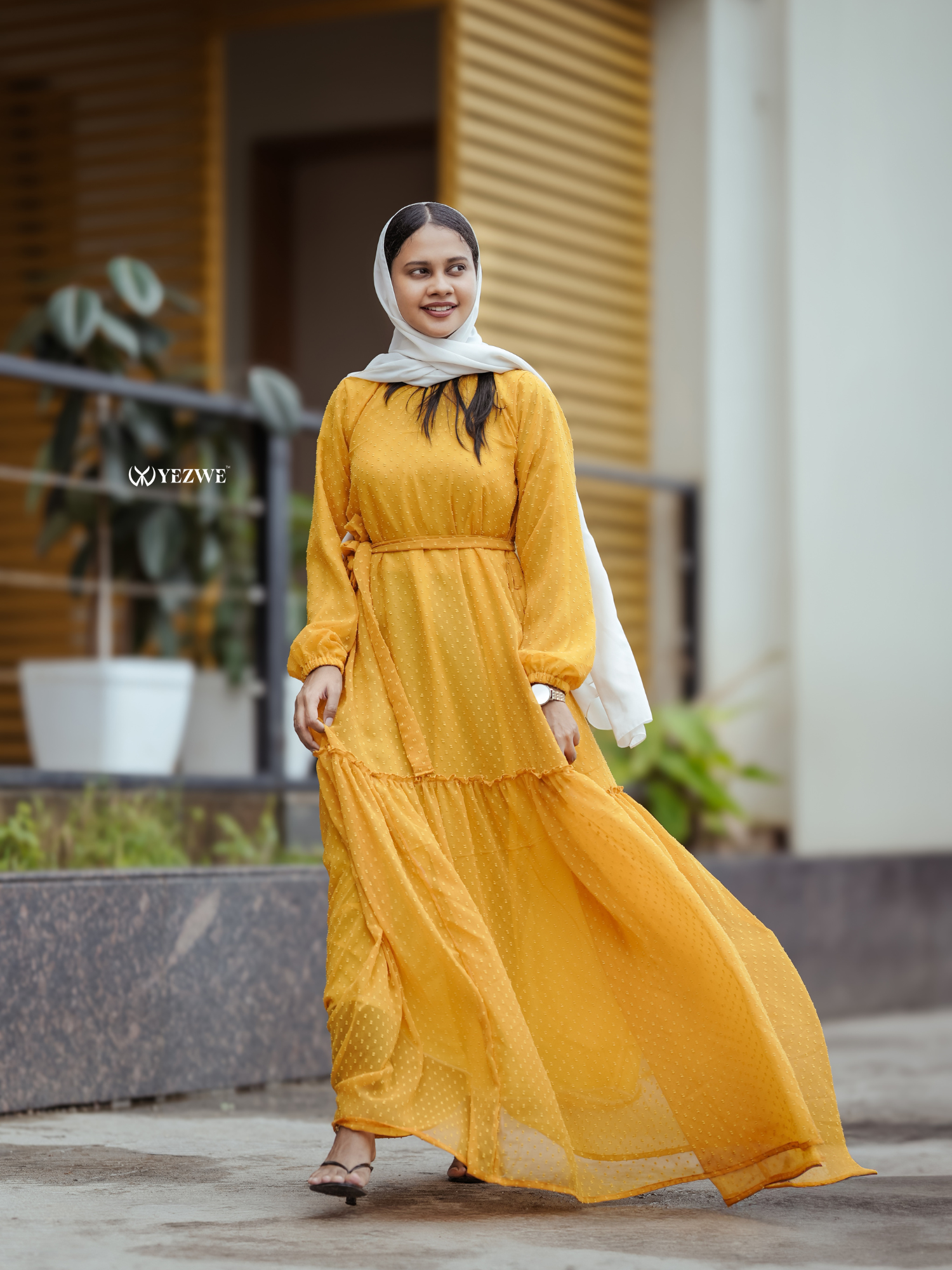 Yezwe yellow textured maxi dress with long sleeves and a flowing design for a stylish appearance